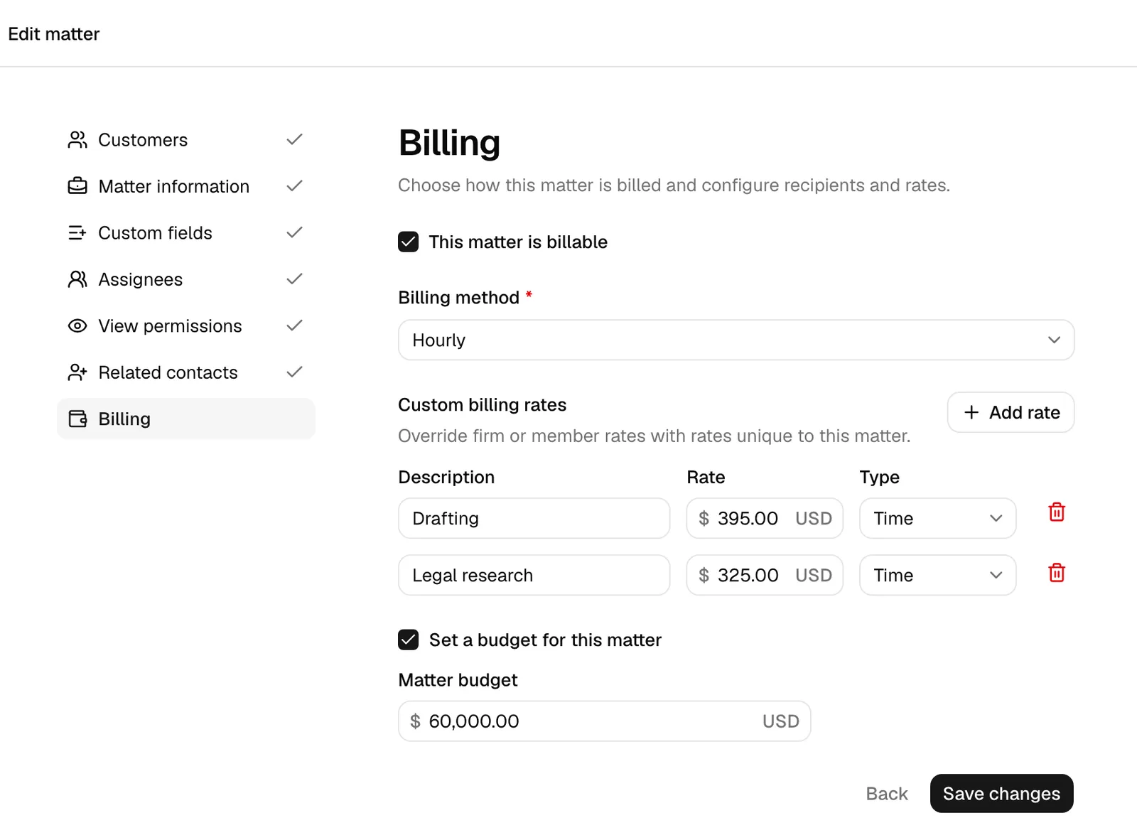 The matter wizard Billing step with Hourly selected and the Custom billing rates section showing one or more rate rows and the Add rate button.