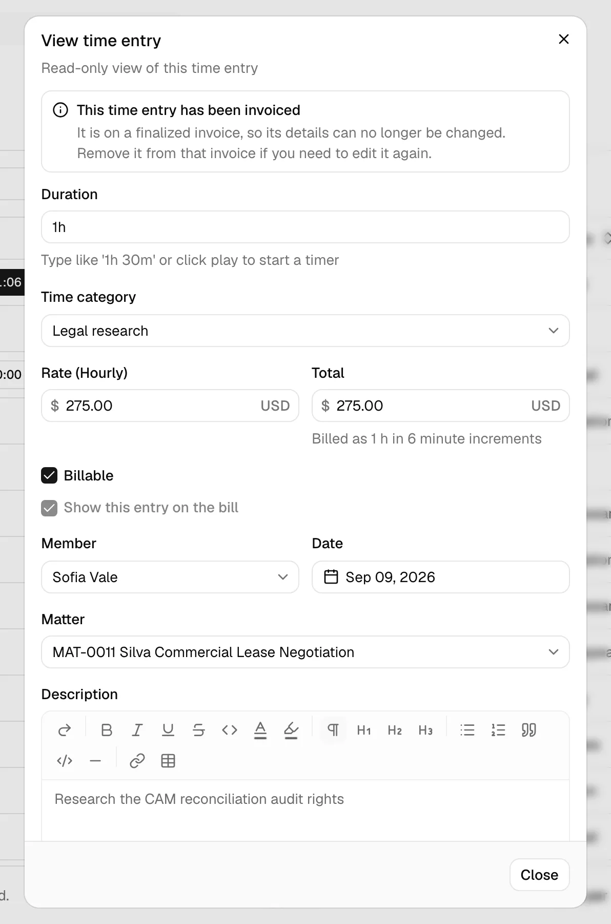 The View time entry dialog with the read-only note at the top explaining that the entry has been invoiced, above the greyed-out fields.